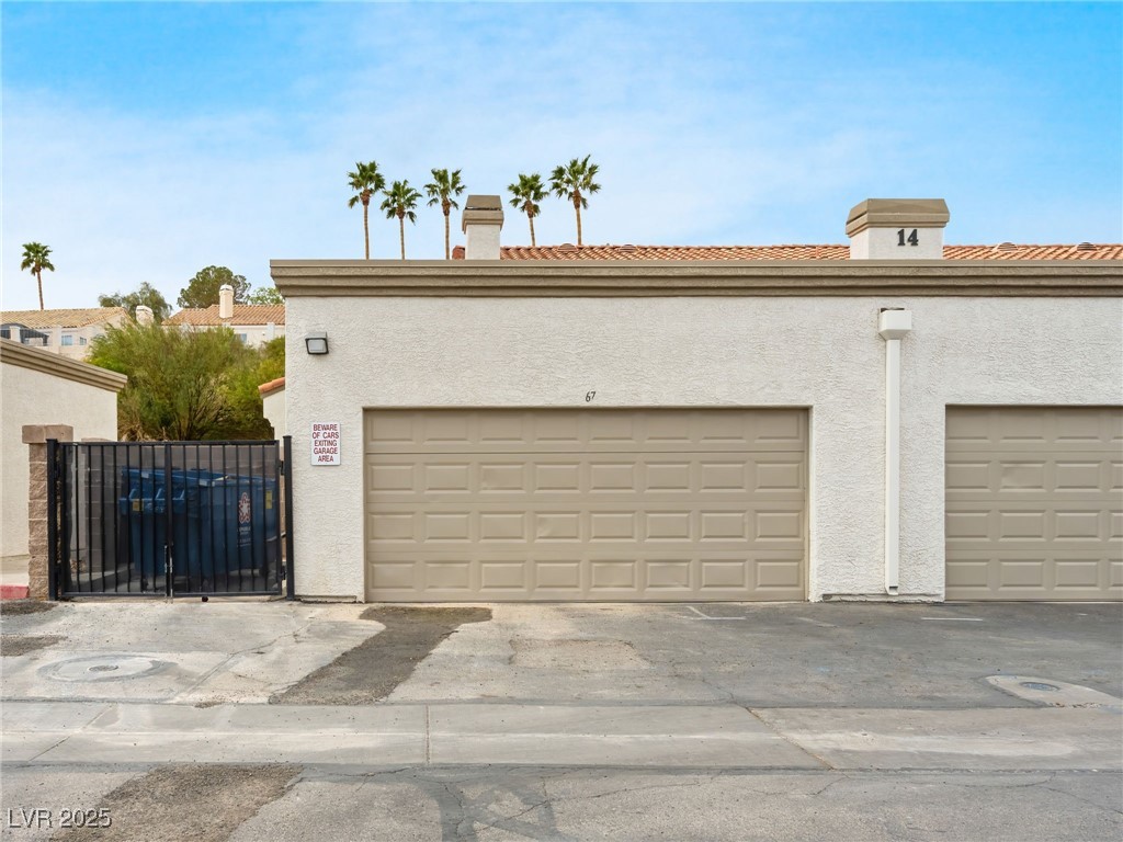 353 Seine Way, Unit N Henderson, NV 89014 - Photo 32 of 36 Garage, connected to home by the patio, courtyard.