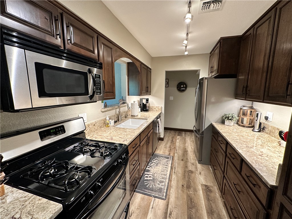 6615 Flag Mine Road Kingman, AZ 86401 - Photo 16 of 72 a kitchen with a stove and a sink