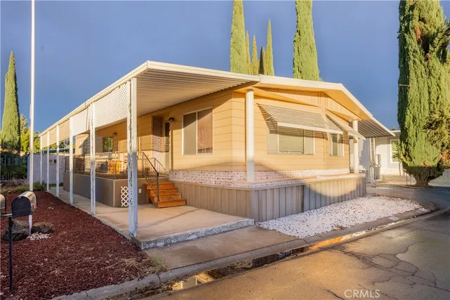 a view of a large building with a small yard