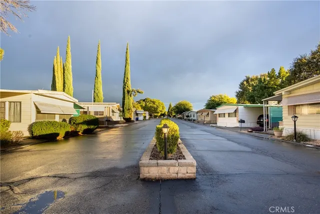 a living room with furniture large window and a fireplace