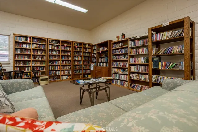 a large kitchen with a table and chairs in it