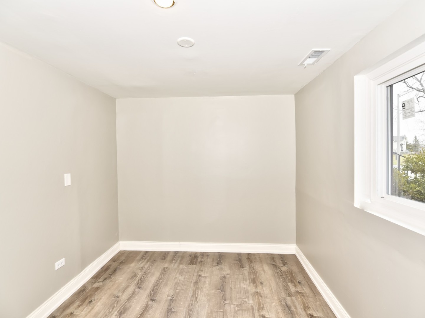 5605 Crestwood Road Matteson, IL 60443 - Photo 16 of 21 a view of an empty room with wooden floor and a window