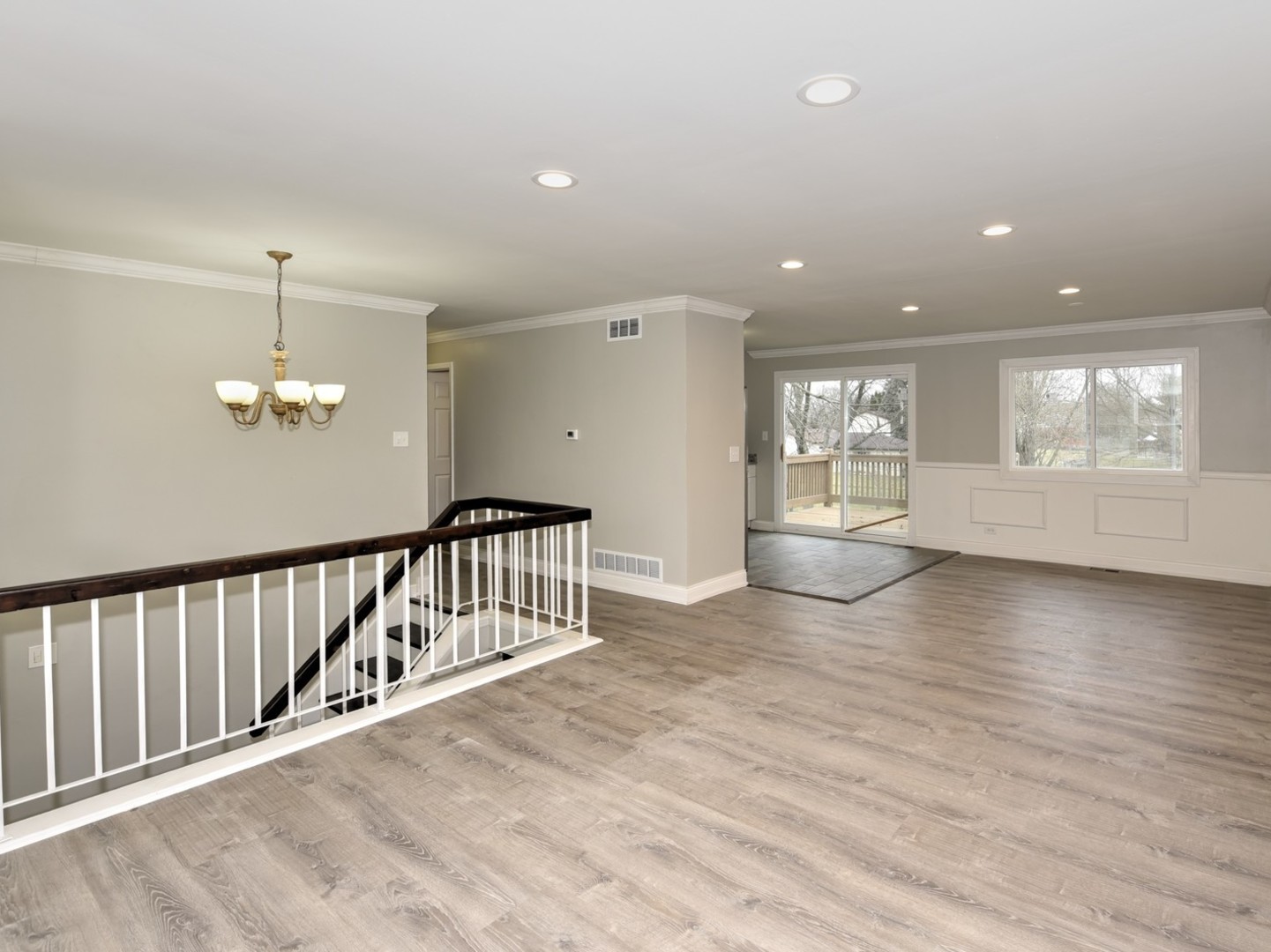 5605 Crestwood Road Matteson, IL 60443 - Photo 3 of 21 an empty room with wooden floor and windows