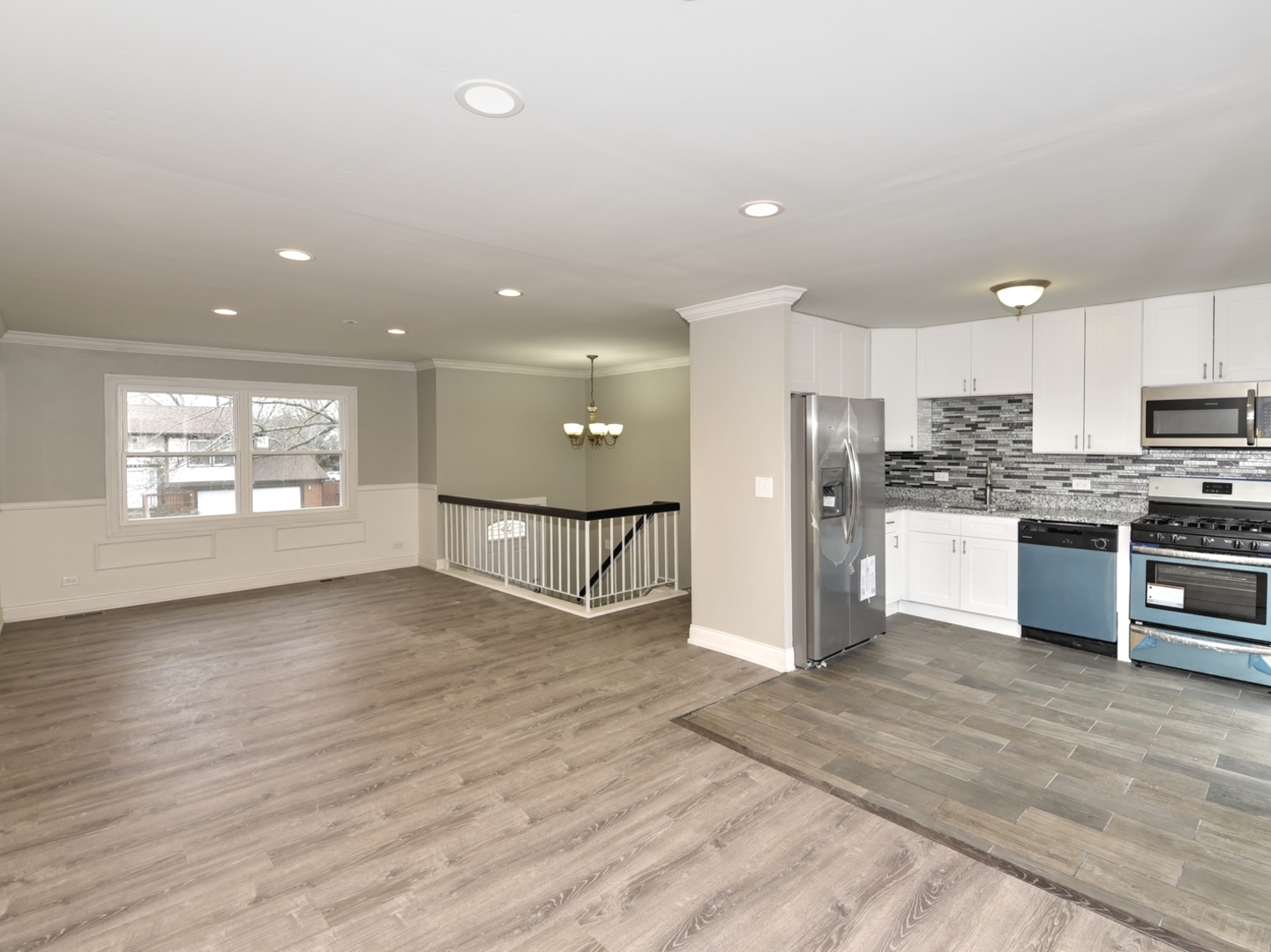 5605 Crestwood Road Matteson, IL 60443 - Photo 5 of 21 a kitchen with stainless steel appliances kitchen island granite countertop a refrigerator and a stove top oven