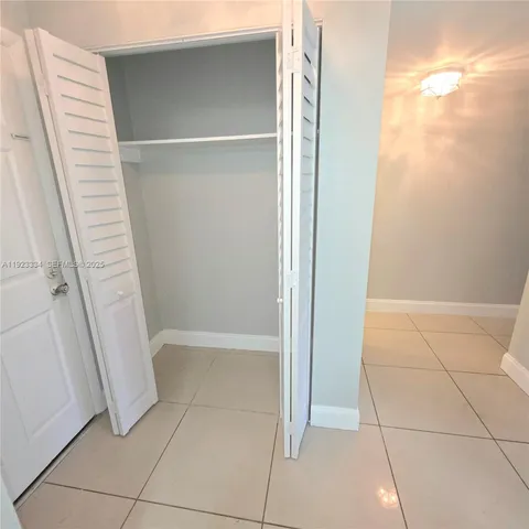 a bathroom with a sink a toilet a mirror and shower