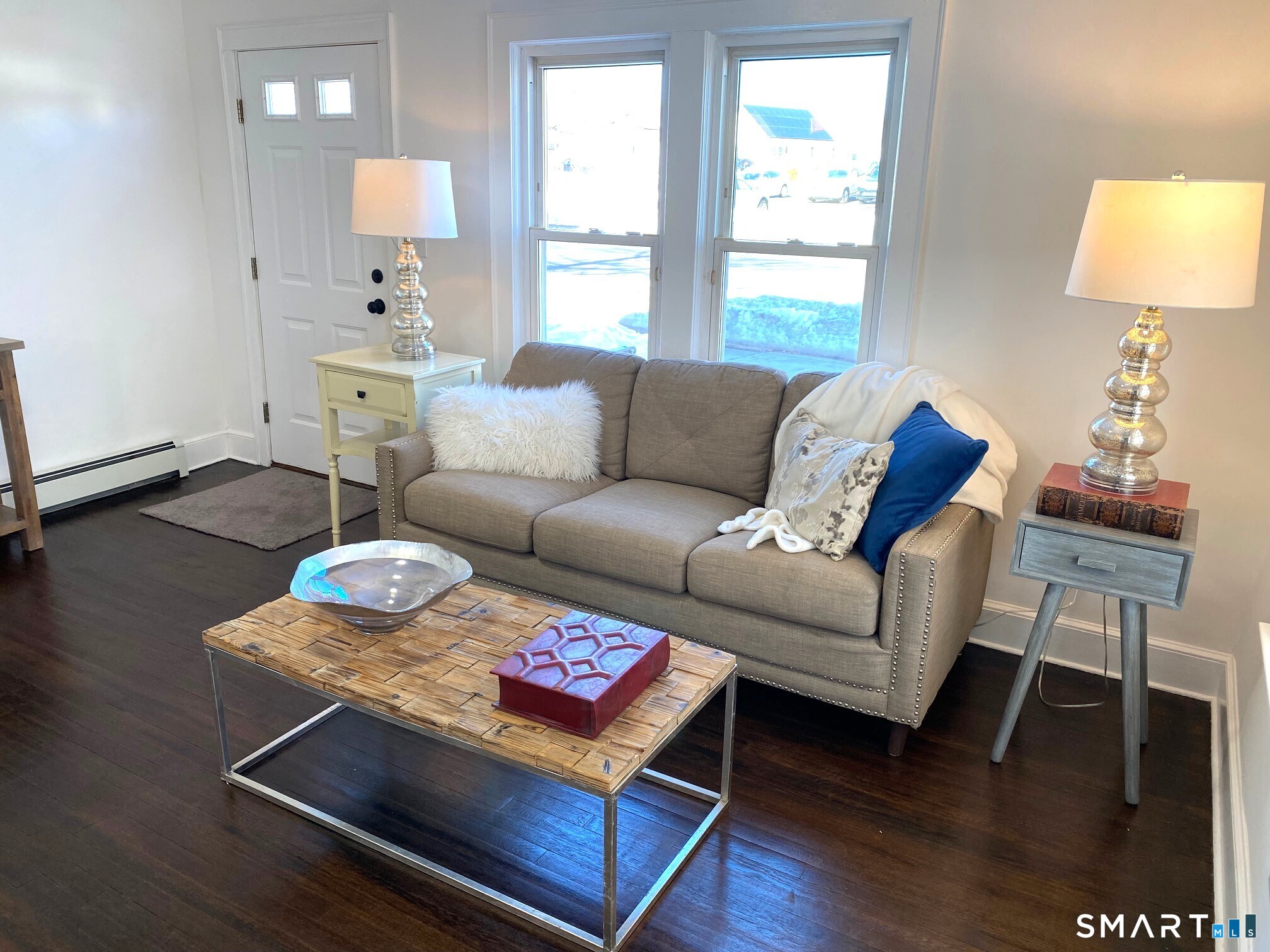 166 Saw Mill Road West Haven, CT 06516 - Photo 13 of 46 a living room with furniture a wooden floor and a lamp