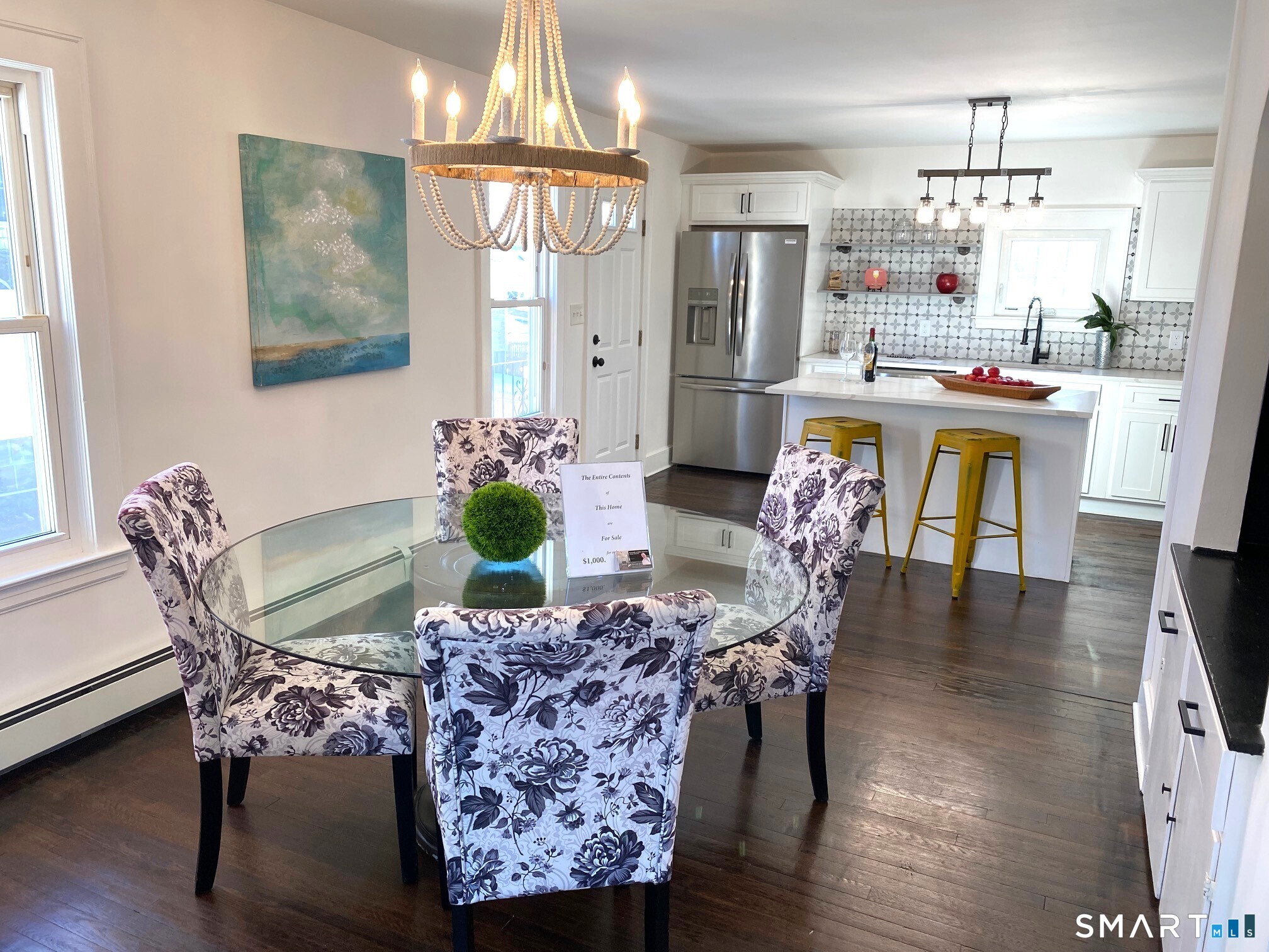 166 Saw Mill Road West Haven, CT 06516 - Photo 45 of 46 a dining room with furniture a chandelier and wooden floor