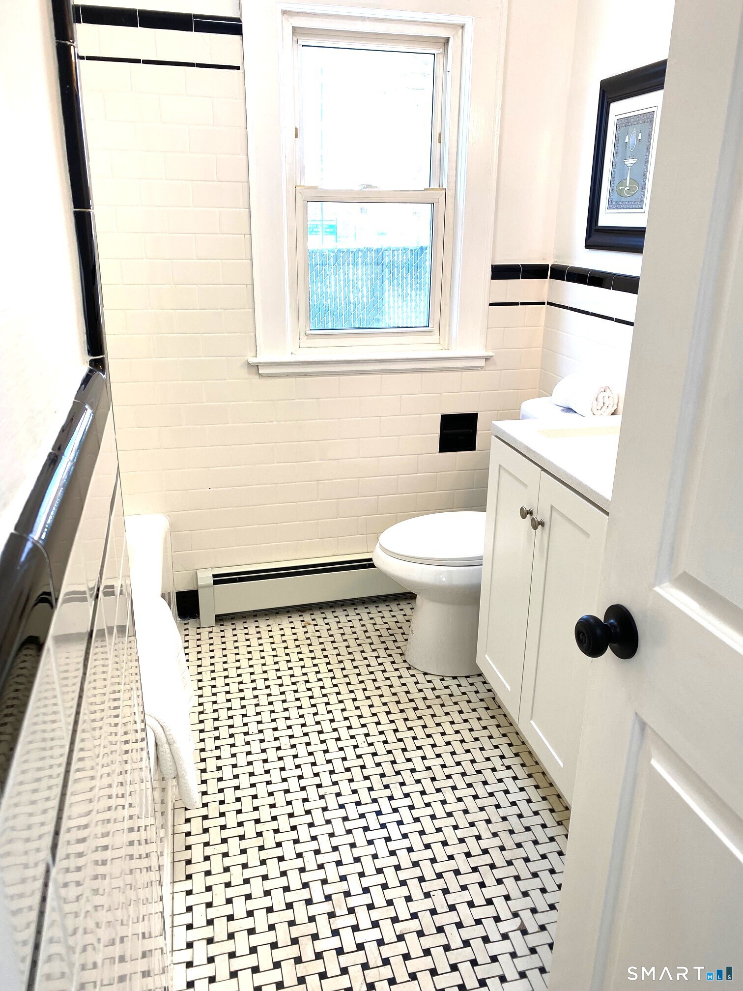 166 Saw Mill Road West Haven, CT 06516 - Photo 25 of 46 a bathroom with a sink a toilet a window and a shower