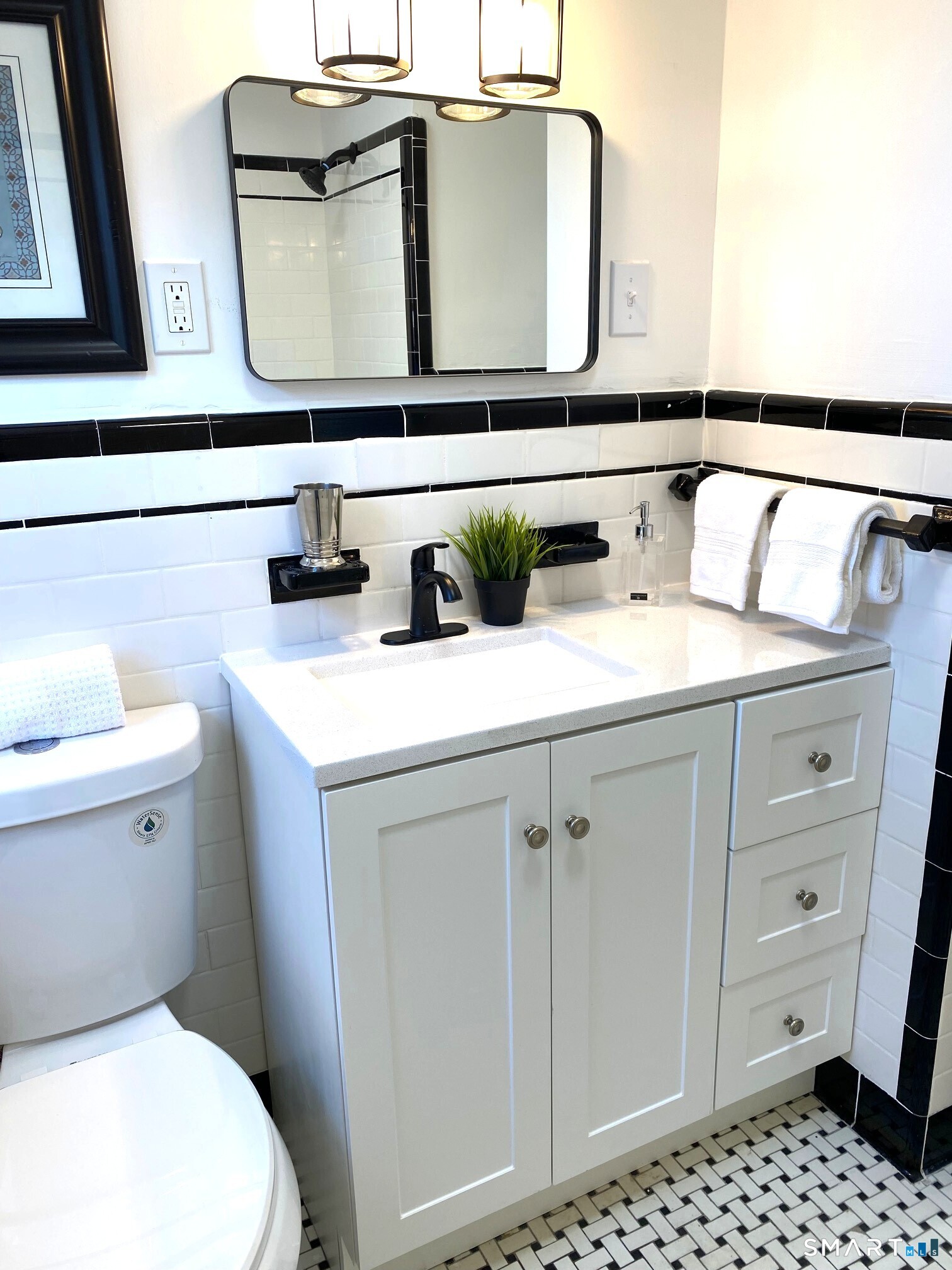 166 Saw Mill Road West Haven, CT 06516 - Photo 26 of 46 a bathroom with a sink a toilet and mirror