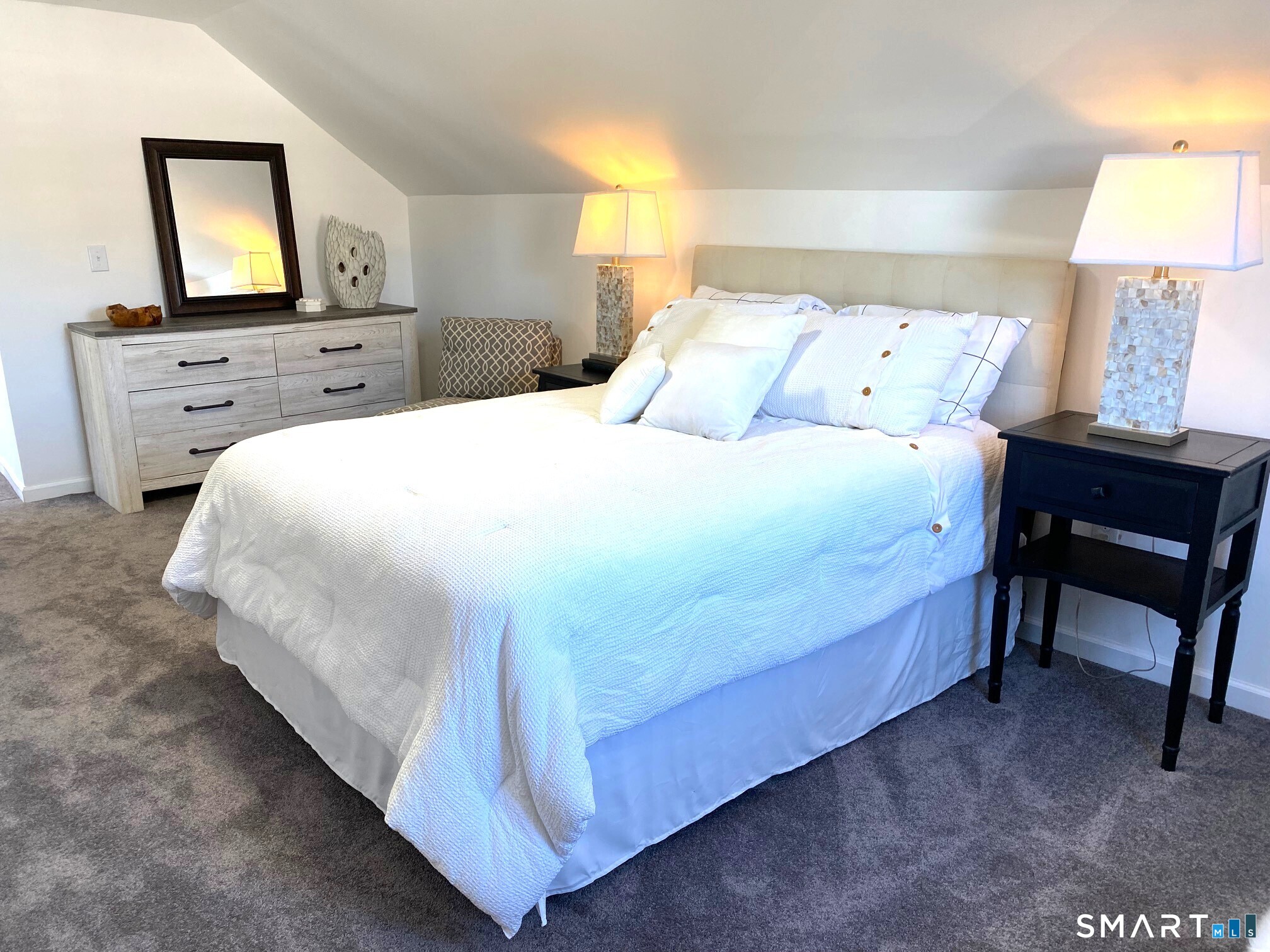 166 Saw Mill Road West Haven, CT 06516 - Photo 28 of 46 a bed sitting in a bedroom with a tv