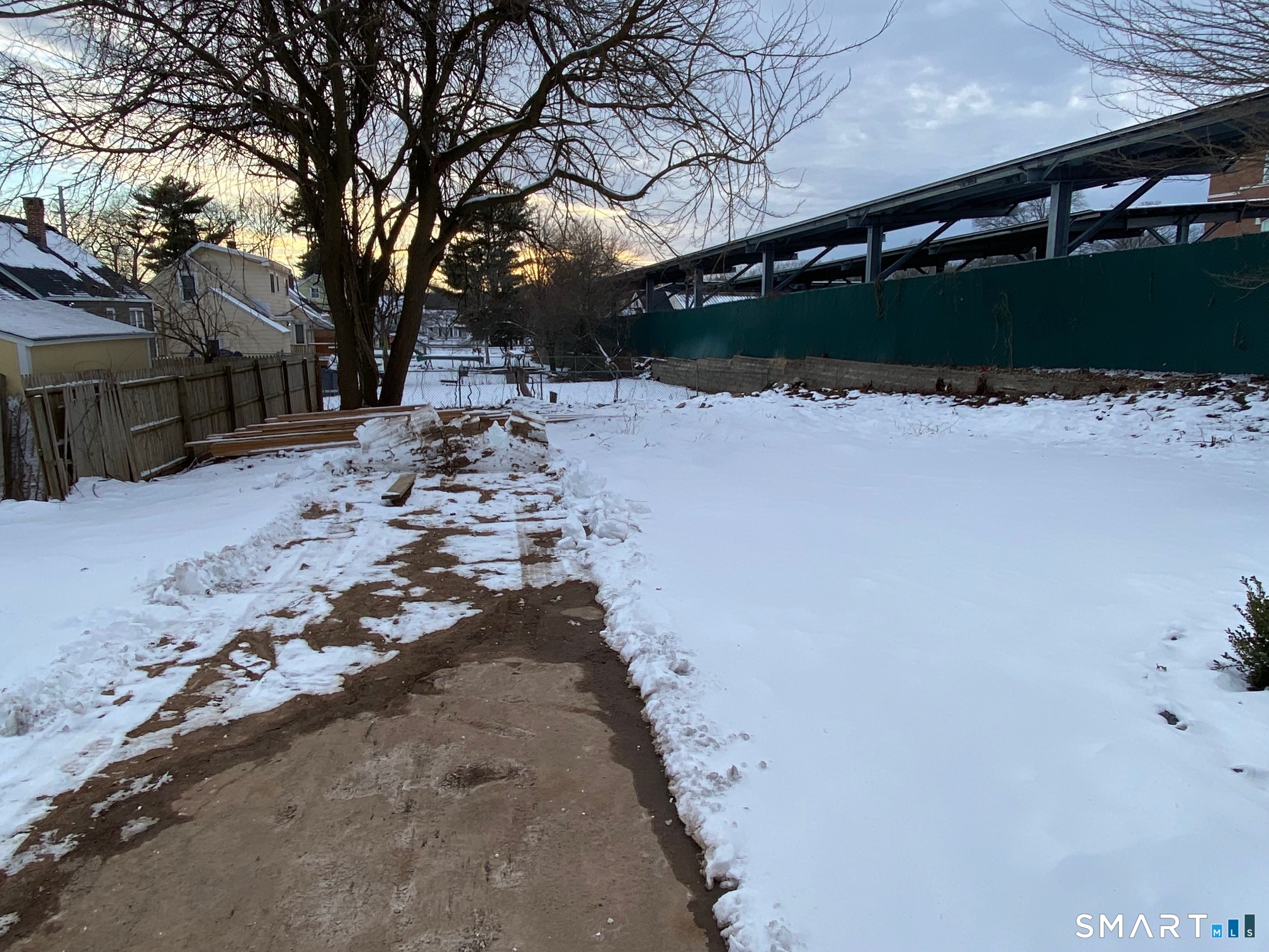 166 Saw Mill Road West Haven, CT 06516 - Photo 39 of 46 HUGE backyard will be regraded and seeded when weather permits. Next door is the employee parking for the West Haven Police Department, very, very quiet!