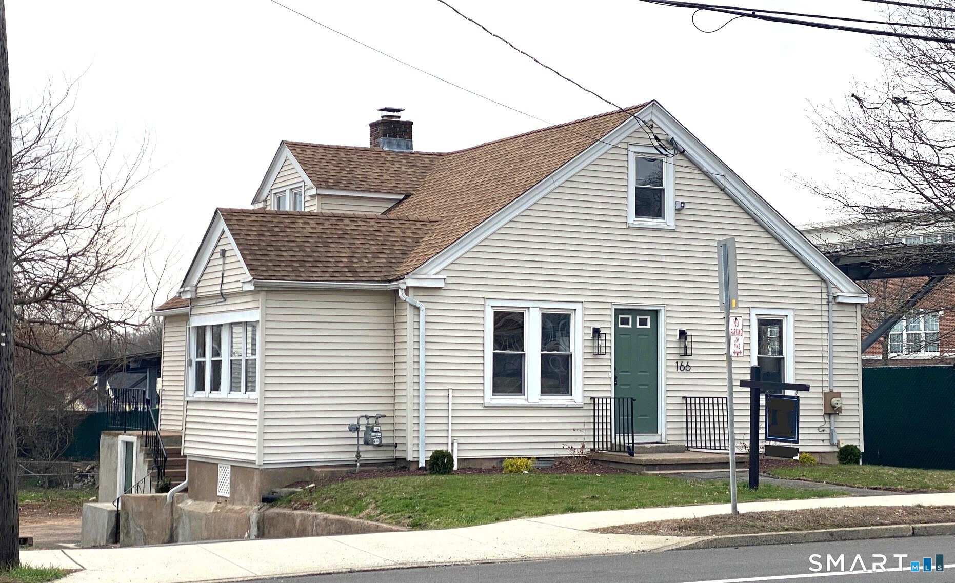 166 Saw Mill Road West Haven, CT 06516 - Photo 4 of 46 a front view of a house with a yard
