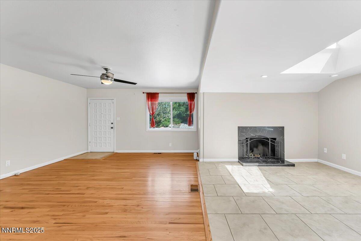 1375 Wesley Drive Reno, NV 89503 - Photo 12 of 35 a view of empty room with fireplace and wooden floor