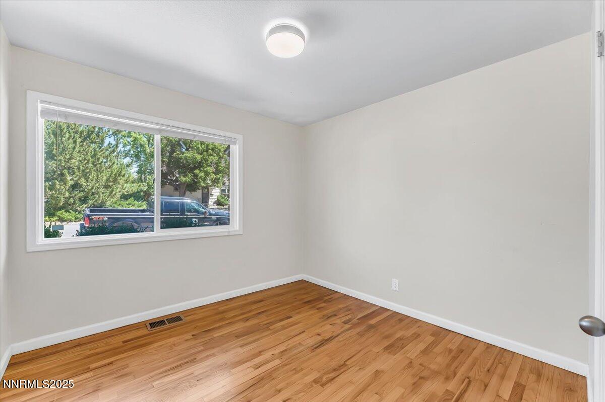 1375 Wesley Drive Reno, NV 89503 - Photo 18 of 35 a view of empty room with wooden floor and fan