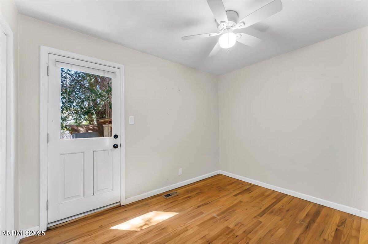 1375 Wesley Drive Reno, NV 89503 - Photo 21 of 35 wooden floor in an empty room with a window