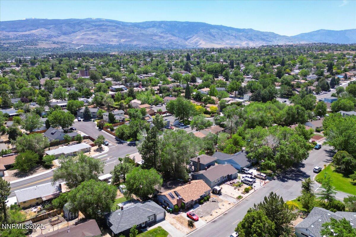 1375 Wesley Drive Reno, NV 89503 - Photo 34 of 35 an aerial view of a city with lots of residential buildings and mountain view in back