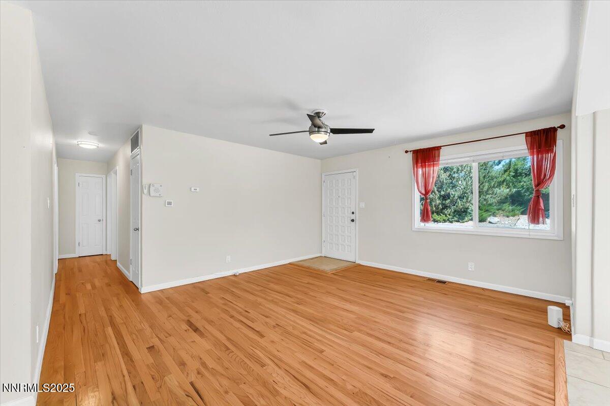 1375 Wesley Drive Reno, NV 89503 - Photo 10 of 35 a view of a big room with wooden floor and windows