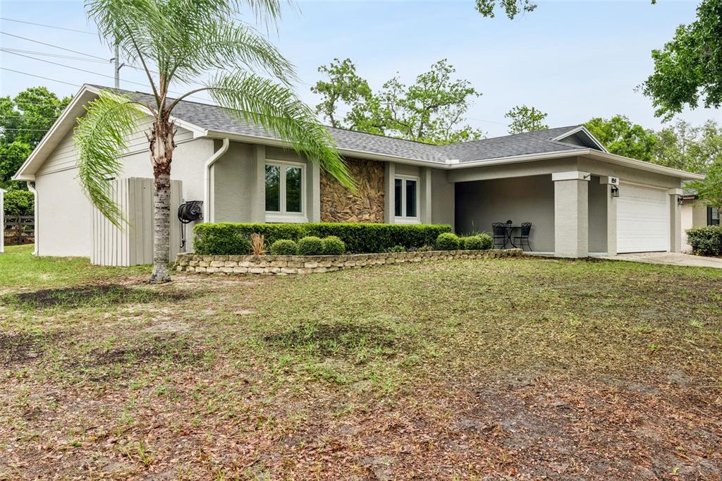 859 Benchwood Drive Winter Springs, FL 32708 - Photo 1 of 35 a front view of house with yard and trees around