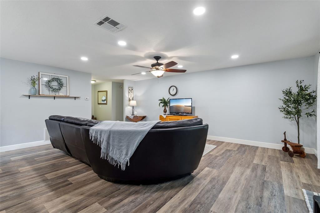 859 Benchwood Drive Winter Springs, FL 32708 - Photo 11 of 35 a living room with furniture and a chandelier