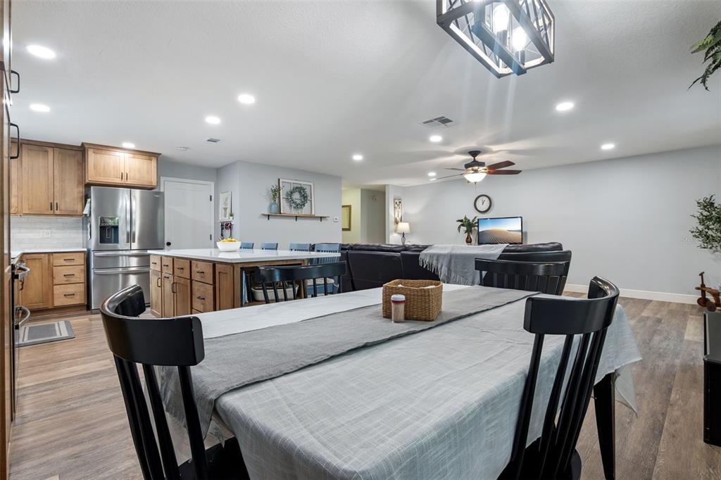 859 Benchwood Drive Winter Springs, FL 32708 - Photo 13 of 35 a kitchen with a dining table chairs and stainless steel appliances