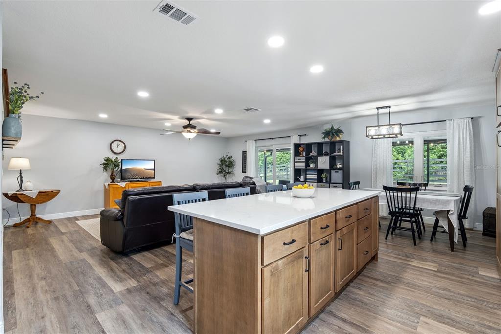 859 Benchwood Drive Winter Springs, FL 32708 - Photo 14 of 35 a large kitchen with kitchen island a sink counter space and wooden floor