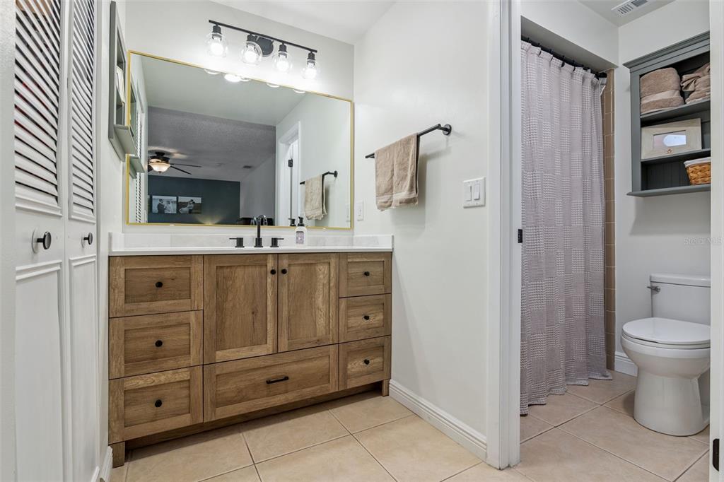 859 Benchwood Drive Winter Springs, FL 32708 - Photo 24 of 35 a bathroom with a toilet a sink and a mirror