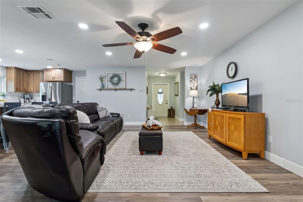 859 Benchwood Drive Winter Springs, FL 32708 - Photo 7 of 35 a living room with furniture and a wooden floor