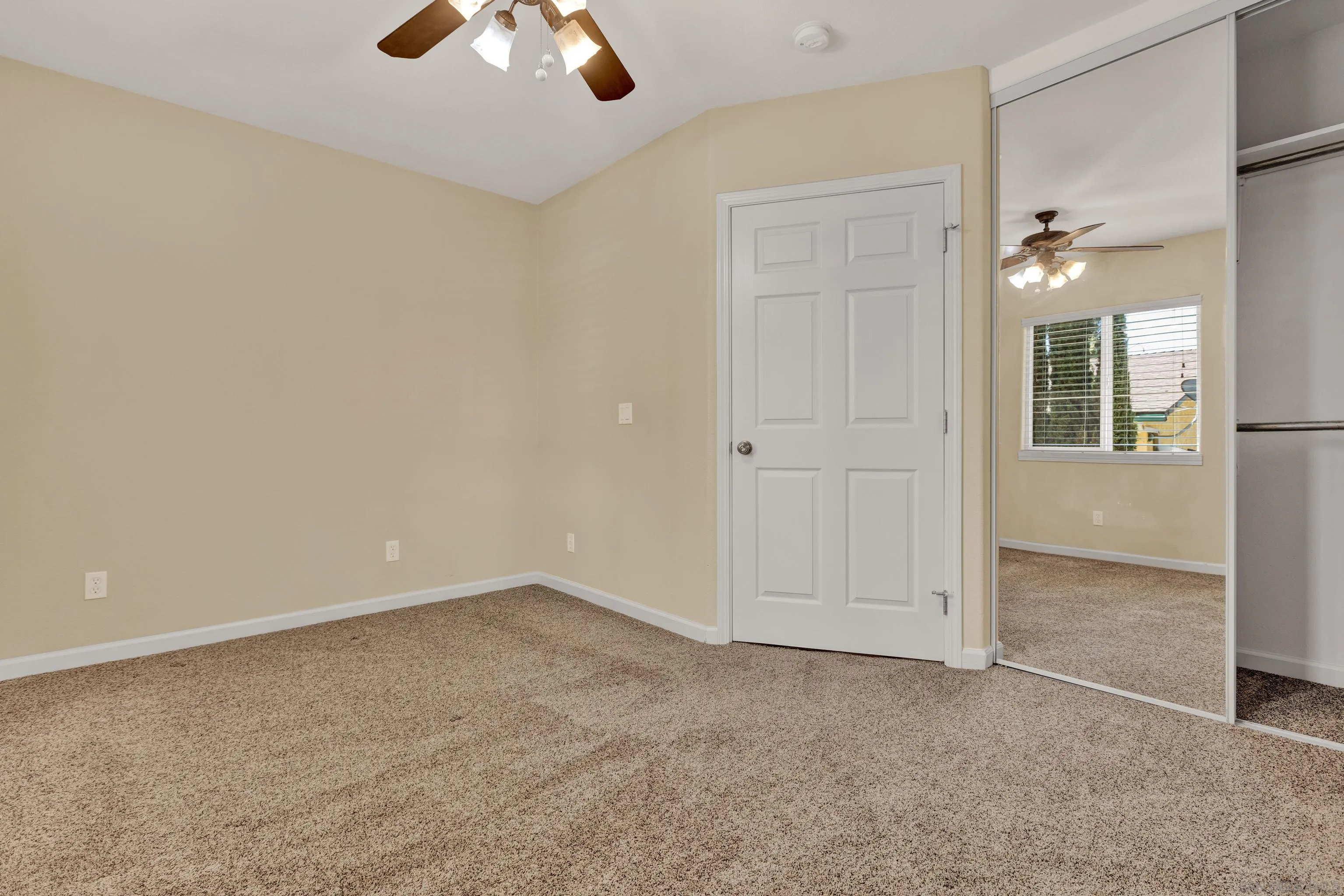 1233 Marshall Road Alpine, CA 91901 - Photo 36 of 44 an empty room with chandelier fan and windows