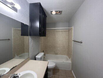 3421 Hyden Avenue Lubbock, TX 79407 - Photo 14 of 16 a bathroom with a toilet a sink and shower