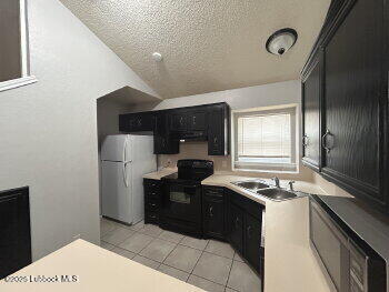 3421 Hyden Avenue Lubbock, TX 79407 - Photo 15 of 16 a kitchen with a refrigerator and a stove