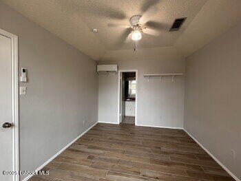 3421 Hyden Avenue Lubbock, TX 79407 - Photo 5 of 16 a view of a livingroom with a ceiling fan wooden floor and window