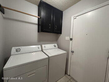 3421 Hyden Avenue Lubbock, TX 79407 - Photo 10 of 16 a utility room with dryer and washer
