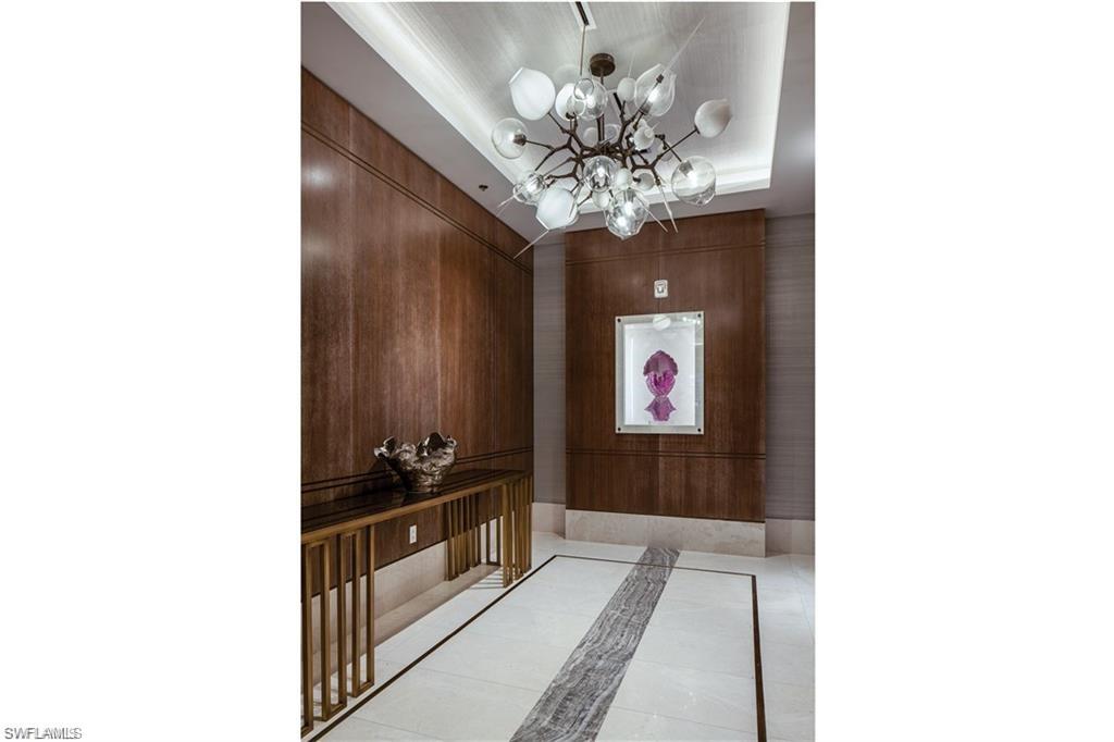 6897 Grenadier Boulevard, Unit 1101 Naples, FL 34108 - Photo 11 of 14 a view of chandelier and kitchen