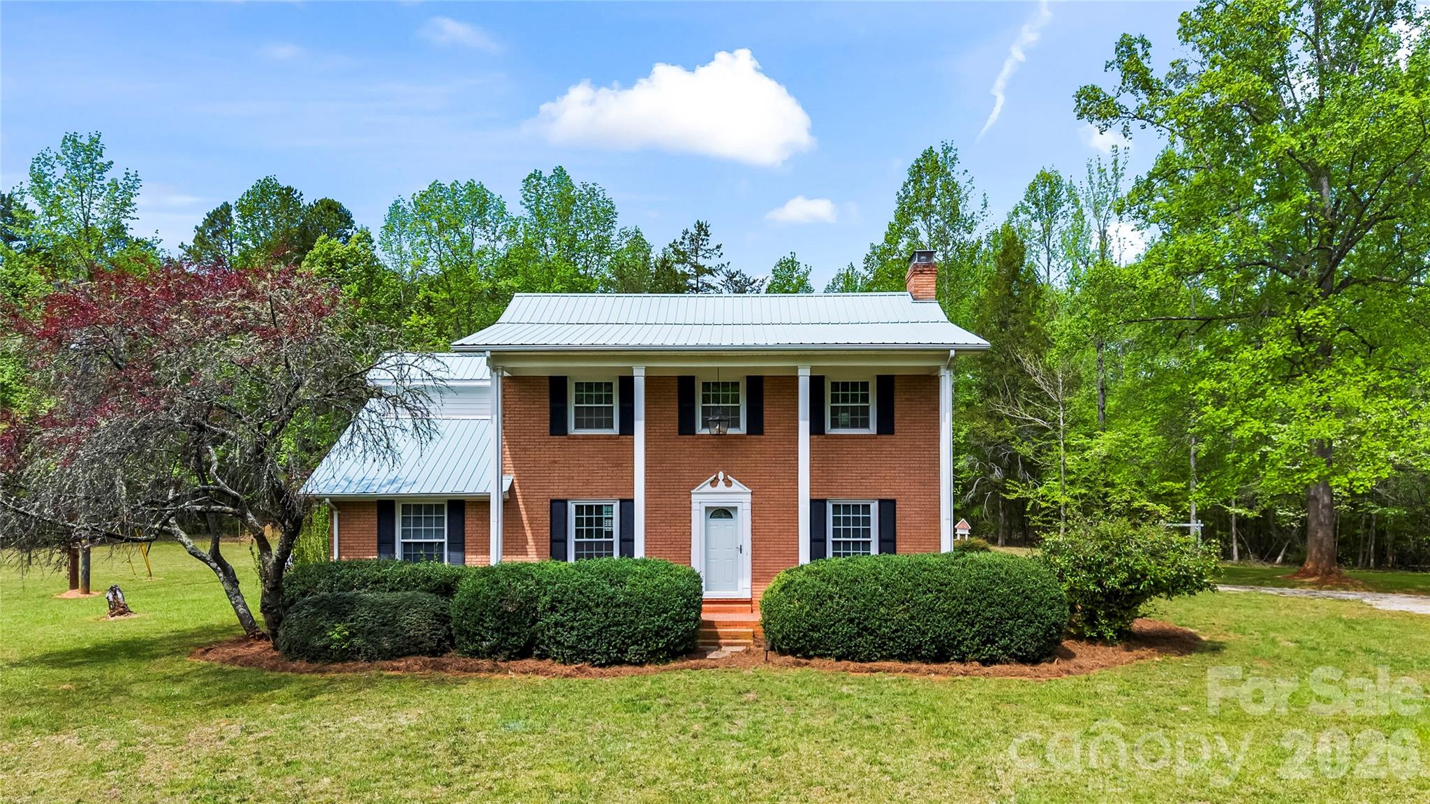 10670 Troutman Road Midland, NC 28107 - Photo 1 of 37 a front view of a house with a yard
