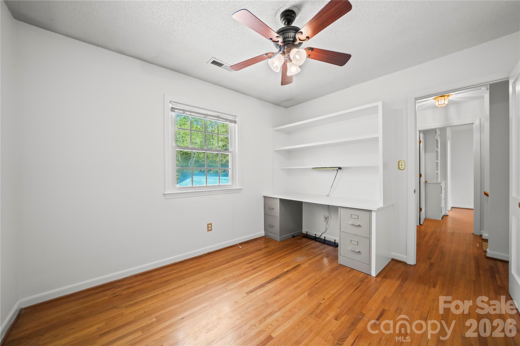 10670 Troutman Road Midland, NC 28107 - Photo 22 of 37 wooden floor in an empty room with a window