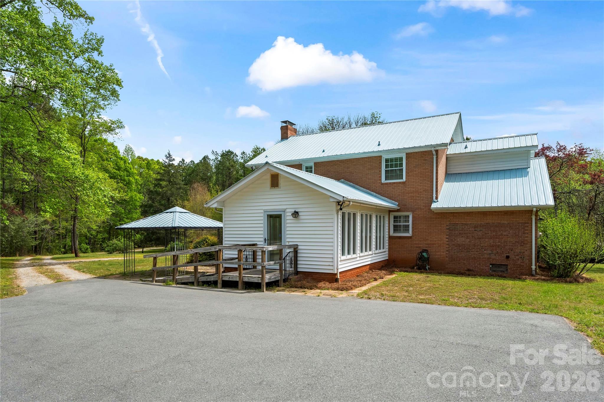 10670 Troutman Road Midland, NC 28107 - Photo 32 of 37 a view of a house with backyard and sitting area