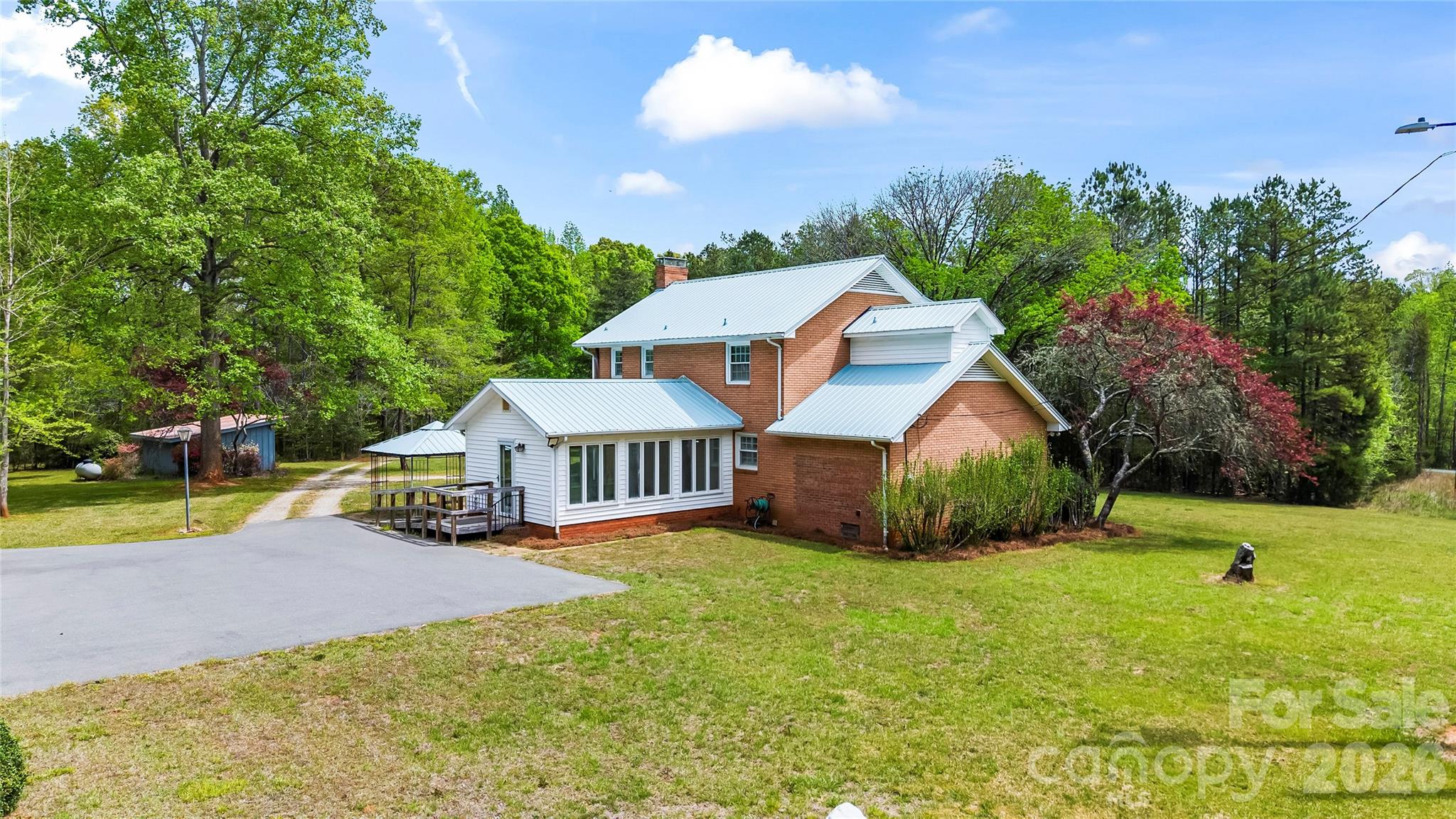 10670 Troutman Road Midland, NC 28107 - Photo 33 of 37 a view of a house with a big yard and large trees
