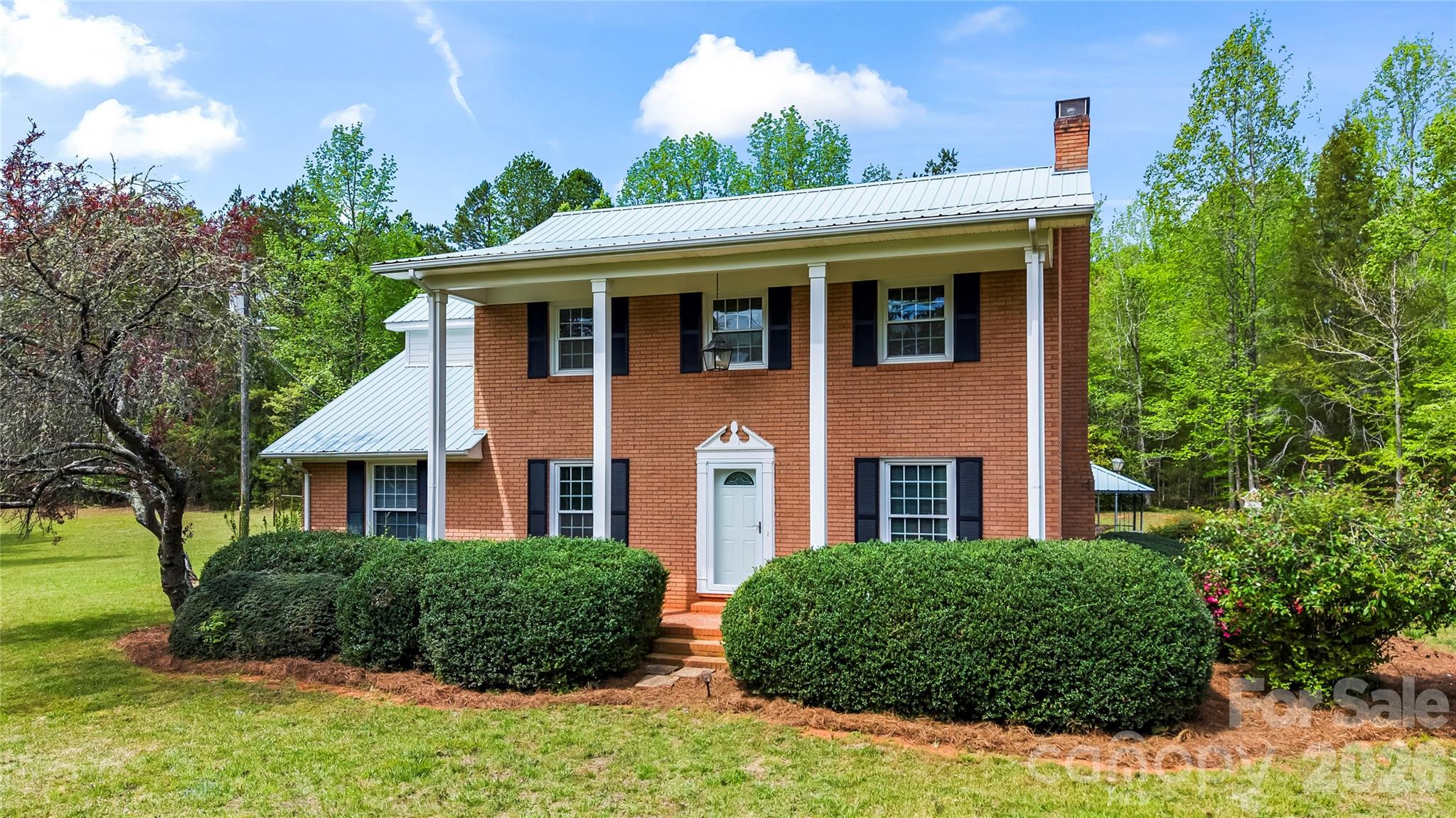10670 Troutman Road Midland, NC 28107 - Photo 35 of 37 a front view of a house with a garden