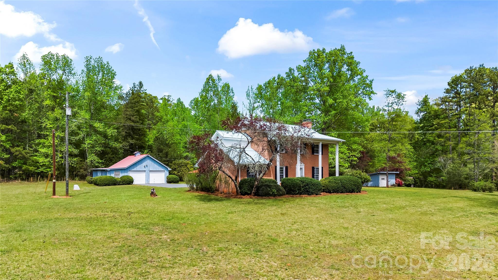 10670 Troutman Road Midland, NC 28107 - Photo 37 of 37 a backyard of a house with table and chairs