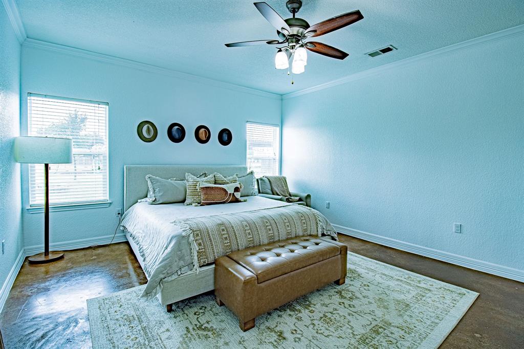 328 Meadow Lane Red Oak, TX 75154 - Photo 15 of 35 Bedroom featuring a textured ceiling, crown molding, a textured wall, a ceiling fan, and concrete flooring