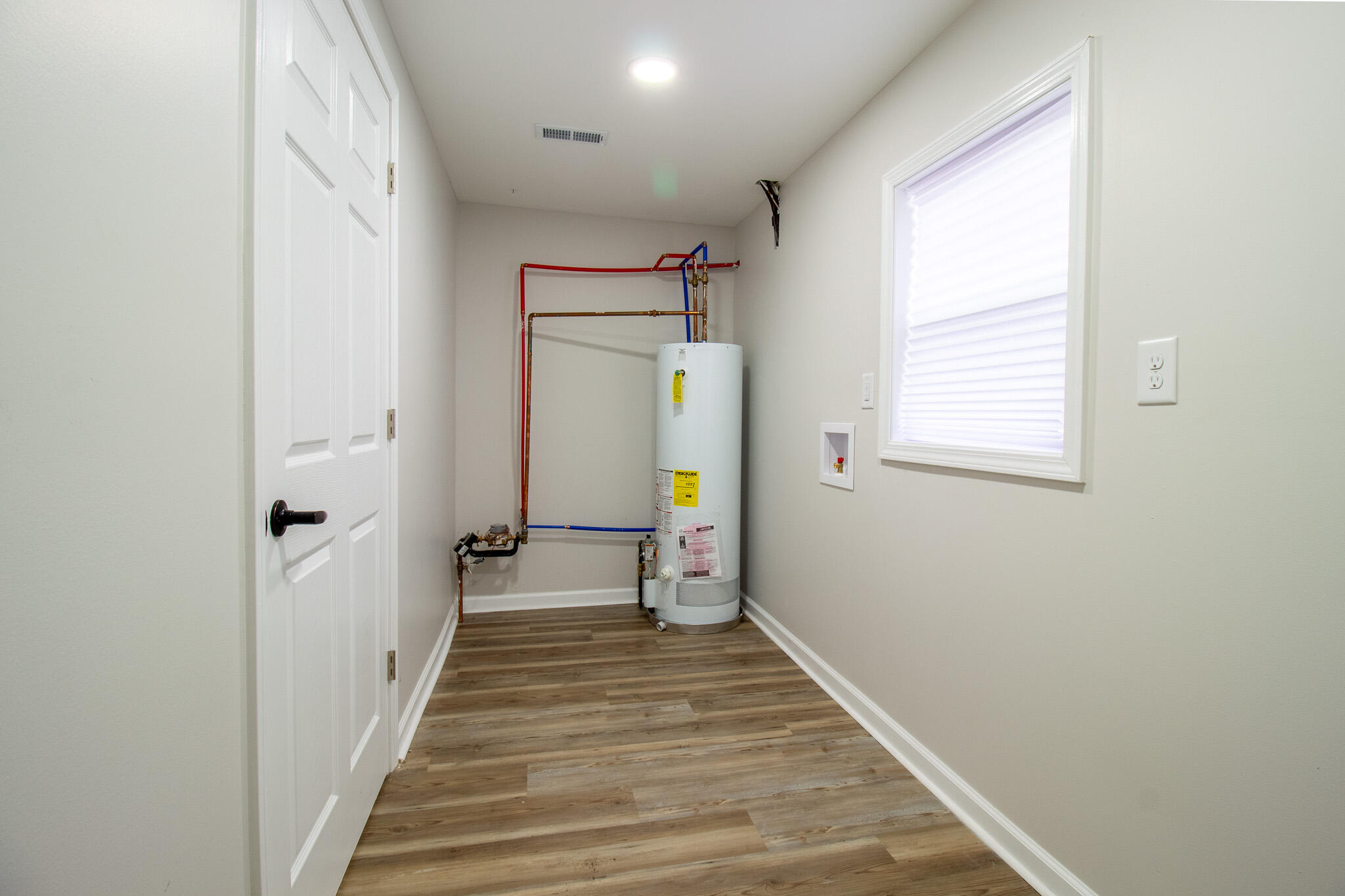 1755 Ralston Street Gary, IN 46406 - Photo 24 of 29 a view of a hallway with wooden floor and staircase