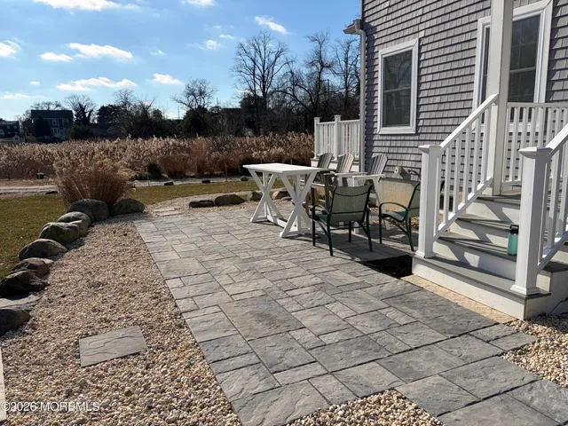 a view of a terrace with furniture