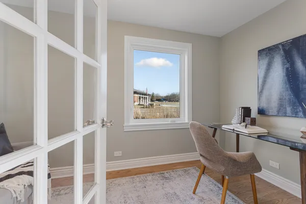 a dining room with furniture and window