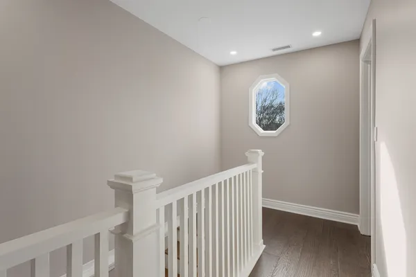 a view of entryway with wooden floor