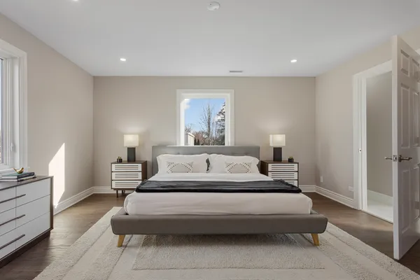 a bed room with a bed and a night stand