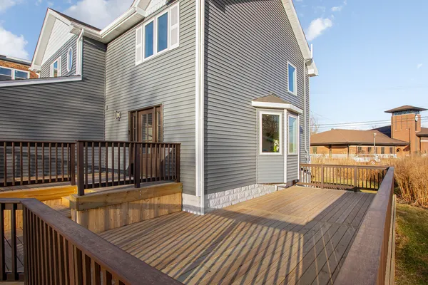 a balcony with a table and chairs