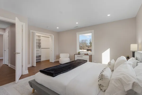 a bedroom with a bed and window