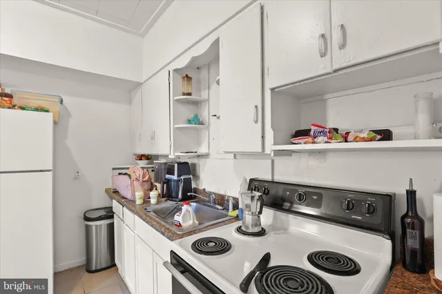 a kitchen with a stove and a refrigerator