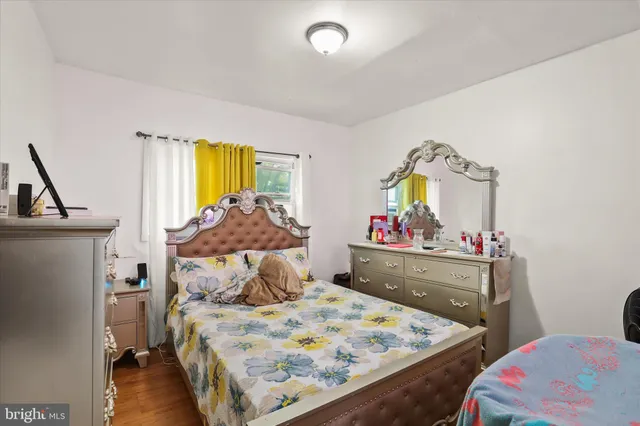 a bed room with furniture and a window