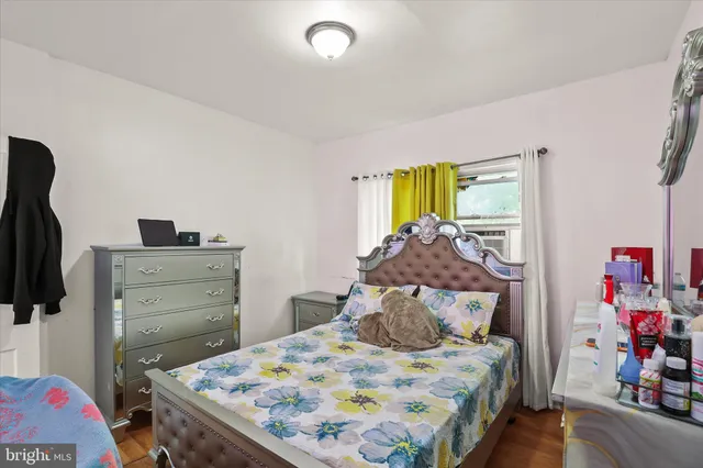 a bedroom with a bed and flat screen tv